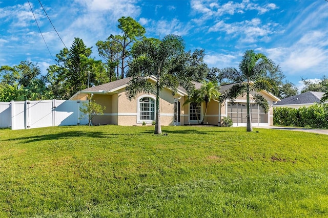 ranch-style home featuring a garage and a front lawn