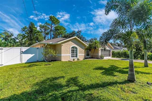 single story home featuring a front yard