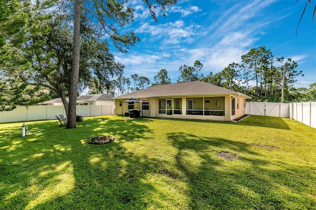 back of house featuring a yard