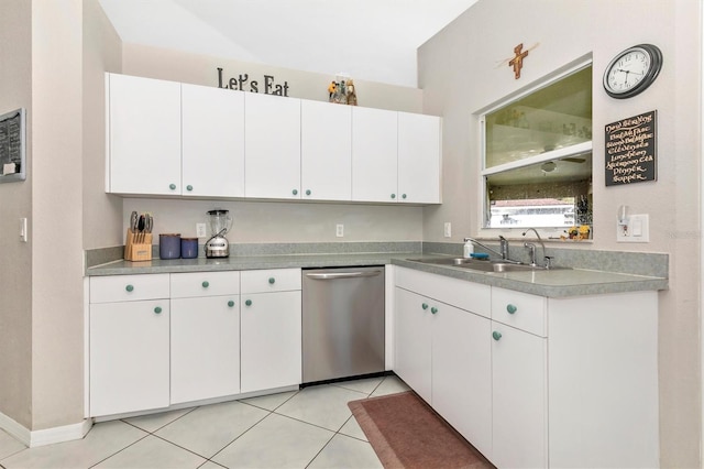 kitchen featuring white cabinets, dishwasher, light tile patterned floors, and sink