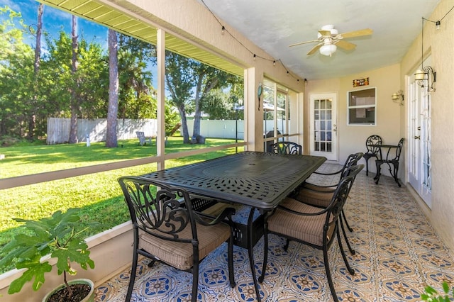 sunroom / solarium with ceiling fan