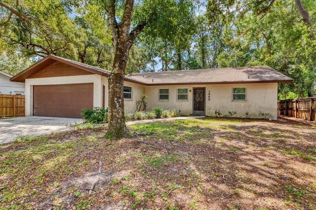 single story home with a garage