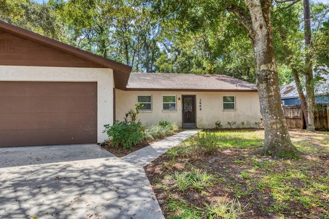 ranch-style home featuring a garage