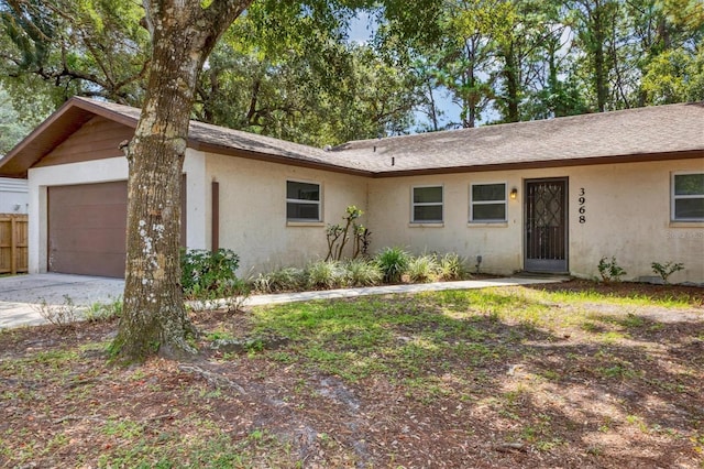 single story home featuring a garage