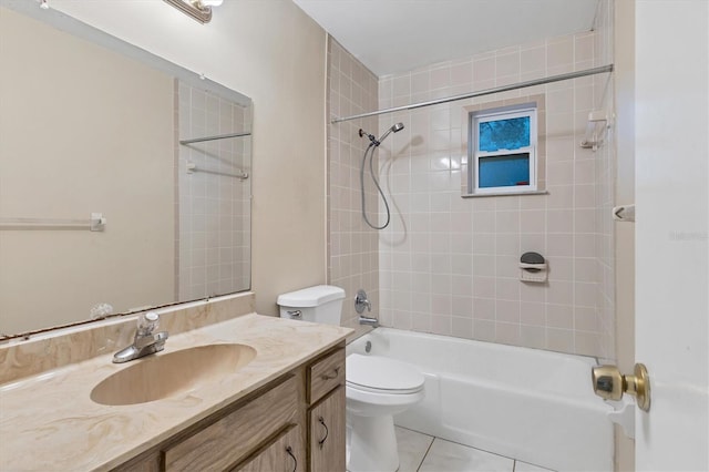 full bathroom featuring tiled shower / bath combo, vanity, toilet, and tile patterned floors