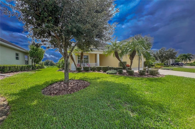 view of front of property with a front lawn and covered porch