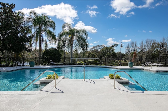 view of pool featuring a patio and pool water feature