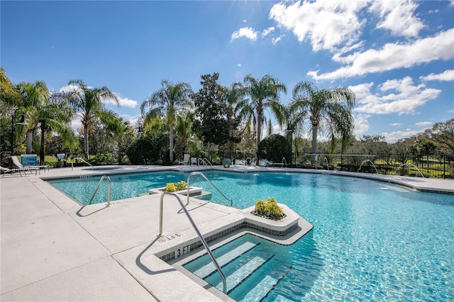 view of swimming pool with a patio