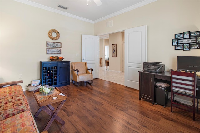 office area featuring ceiling fan, hardwood / wood-style flooring, and crown molding