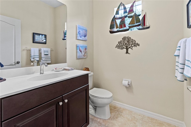 bathroom featuring vanity, toilet, and tile patterned floors