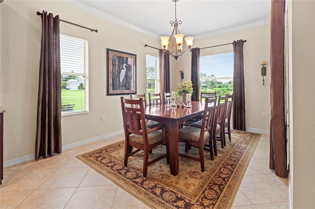 tiled dining space featuring a notable chandelier, crown molding, and plenty of natural light