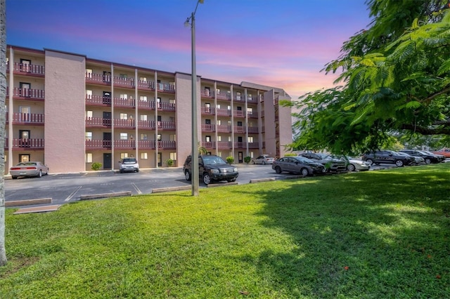 view of outdoor building at dusk