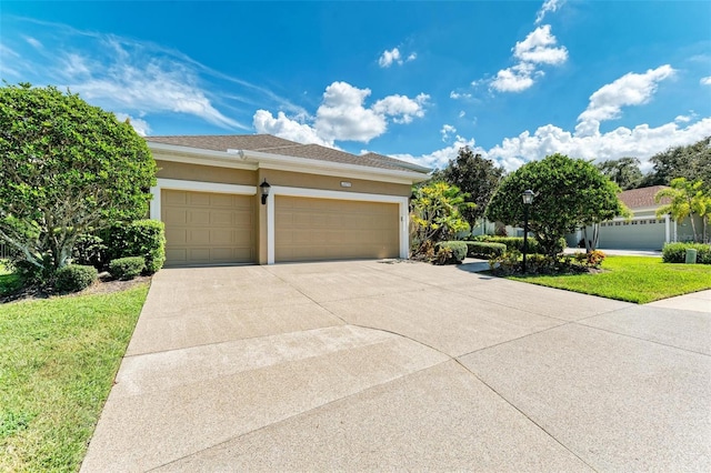 view of front of property featuring a garage and a front yard