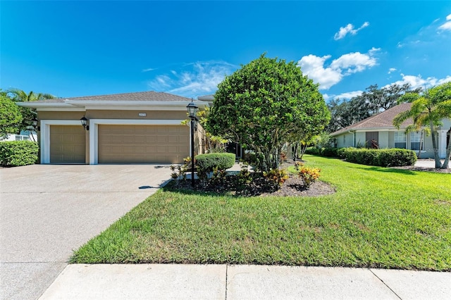 view of front of property featuring a garage and a front lawn