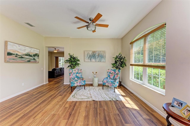 unfurnished room featuring ceiling fan and hardwood / wood-style flooring