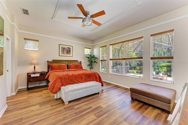 bedroom with ceiling fan and light hardwood / wood-style flooring