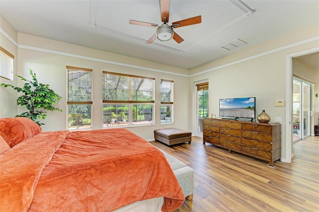 bedroom with ceiling fan and hardwood / wood-style floors