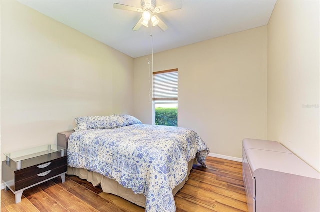 bedroom with hardwood / wood-style floors and ceiling fan