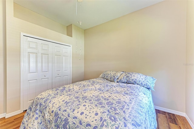 bedroom with a closet and hardwood / wood-style flooring