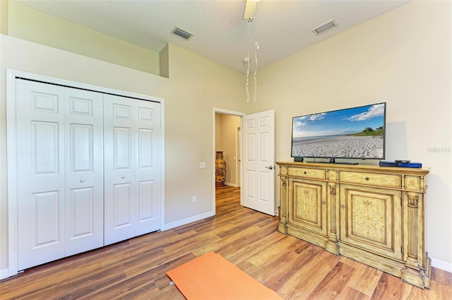 interior space with lofted ceiling and hardwood / wood-style flooring