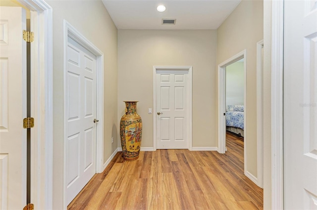 hallway featuring light wood-type flooring