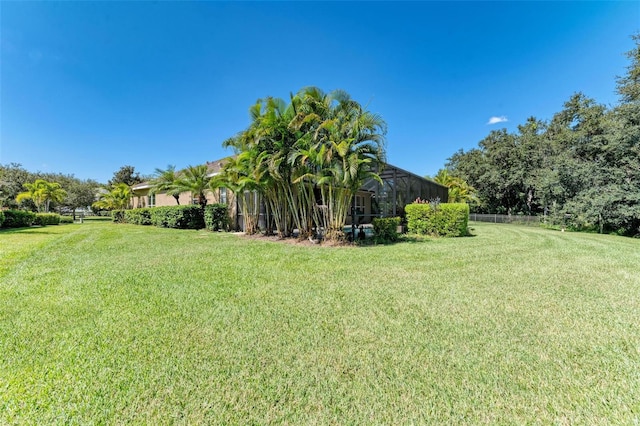 view of yard with a lanai