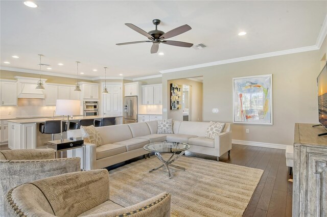 living room featuring ornamental molding, ceiling fan, and light hardwood / wood-style flooring