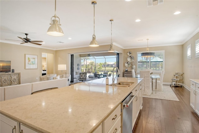 kitchen featuring an island with sink, white cabinetry, dark hardwood / wood-style flooring, ceiling fan, and stainless steel dishwasher