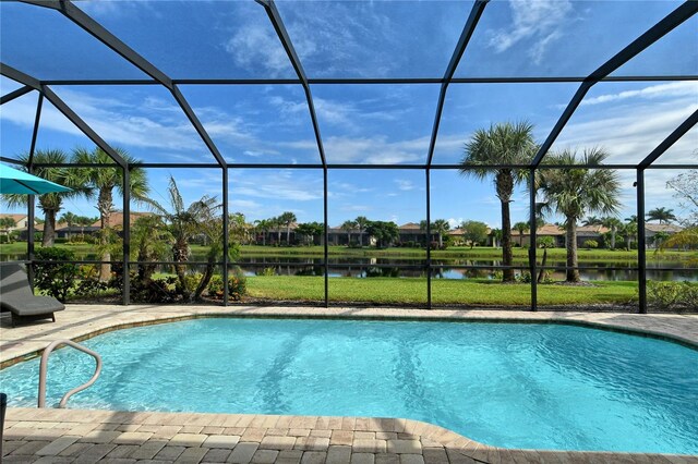 view of pool with a water view and a lanai