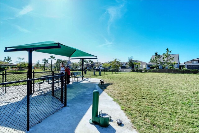 view of property's community with a playground and a yard