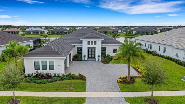 view of front of home featuring a water view and a front yard