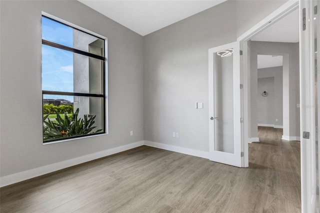 empty room with light hardwood / wood-style floors