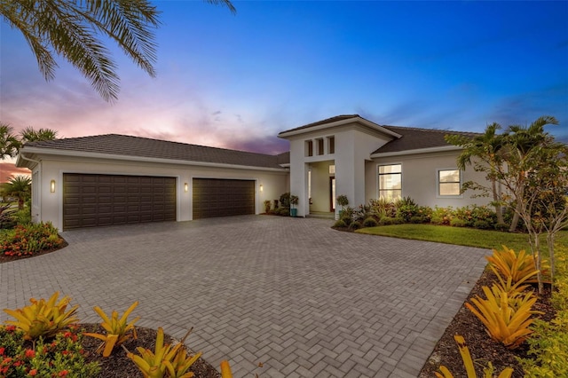 view of front of property with a garage