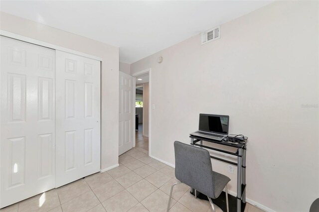 office area with light tile patterned floors