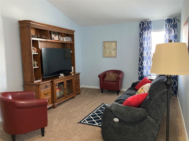 carpeted living room with vaulted ceiling