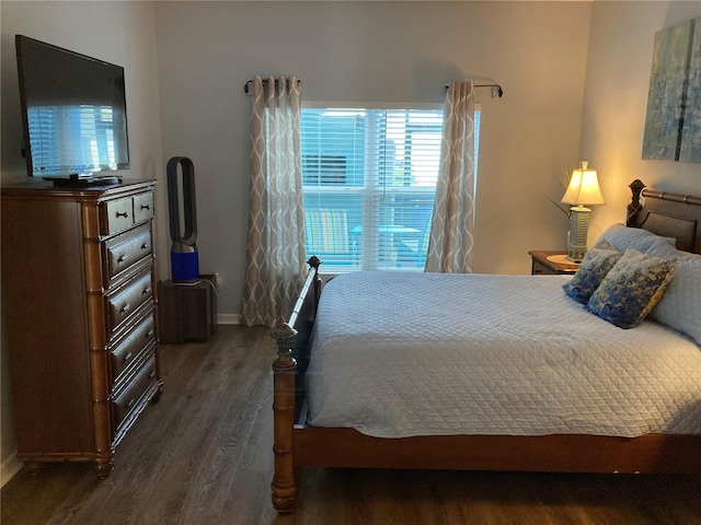 bedroom featuring dark hardwood / wood-style flooring