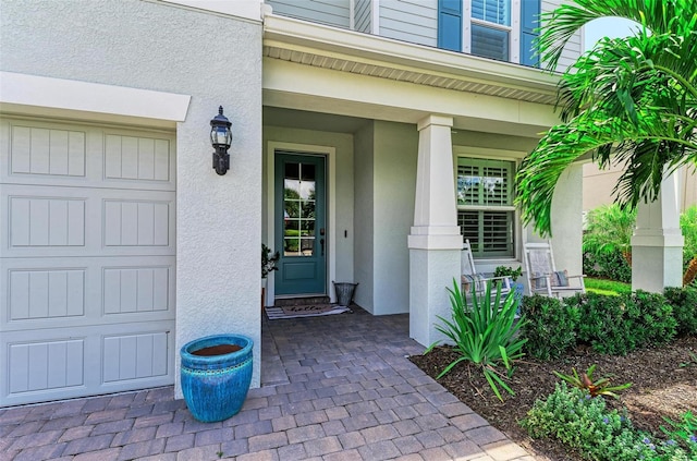 property entrance with a porch and a garage