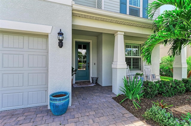 3360 Chestertown Loop, Bradenton, FL 34211 - doorway to property featuring covered porch and stucco siding
