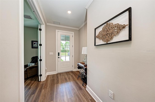 3360 Chestertown Loop, Bradenton, FL 34211 - doorway to outside featuring ornamental molding, baseboards, dark wood-style floors, and visible vents