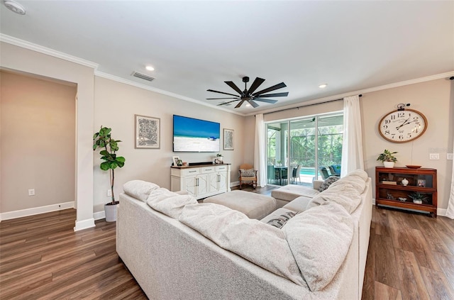 living room featuring ornamental molding, wood-type flooring, and ceiling fan