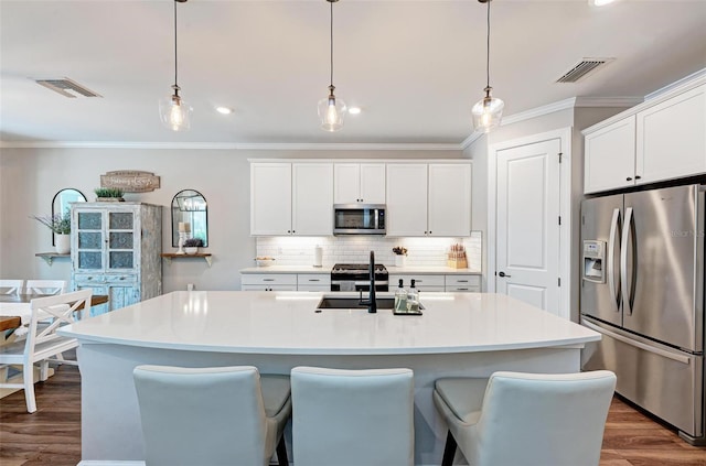 3360 Chestertown Loop, Bradenton, FL 34211 - kitchen featuring crown molding, appliances with stainless steel finishes, and visible vents
