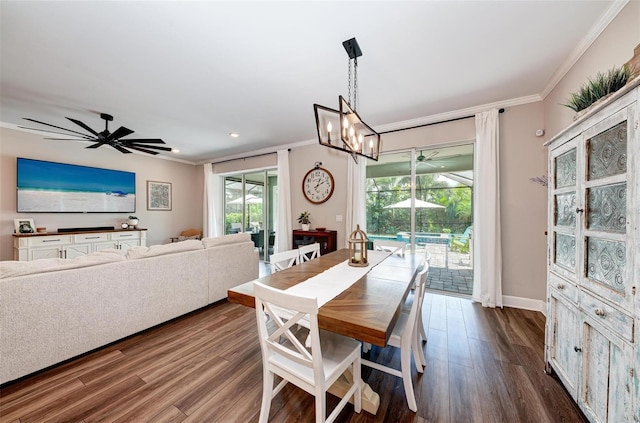 3360 Chestertown Loop, Bradenton, FL 34211 - dining space with crown molding, a wealth of natural light, ceiling fan with notable chandelier, and dark wood-style floors
