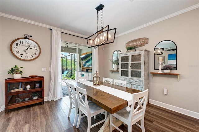 3360 Chestertown Loop, Bradenton, FL 34211 - dining space with crown molding, baseboards, dark wood-style floors, and a chandelier