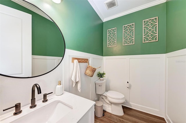 3360 Chestertown Loop, Bradenton, FL 34211 - bathroom with toilet, wood finished floors, vanity, visible vents, and crown molding