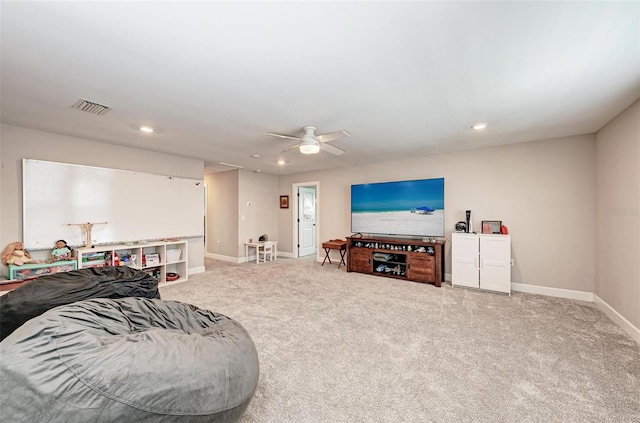 living room featuring carpet floors and ceiling fan