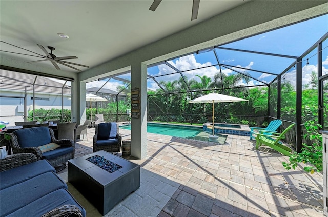 3360 Chestertown Loop, Bradenton, FL 34211 - view of patio / terrace with a ceiling fan, an outdoor living space with a fire pit, a pool with connected hot tub, and a lanai