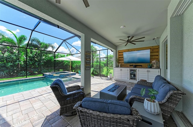 3360 Chestertown Loop, Bradenton, FL 34211 - view of patio / terrace featuring a pool with connected hot tub, a lanai, an outdoor kitchen, and a ceiling fan