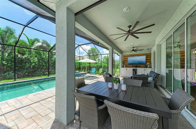 view of patio / terrace with a lanai, ceiling fan, and an outdoor hangout area