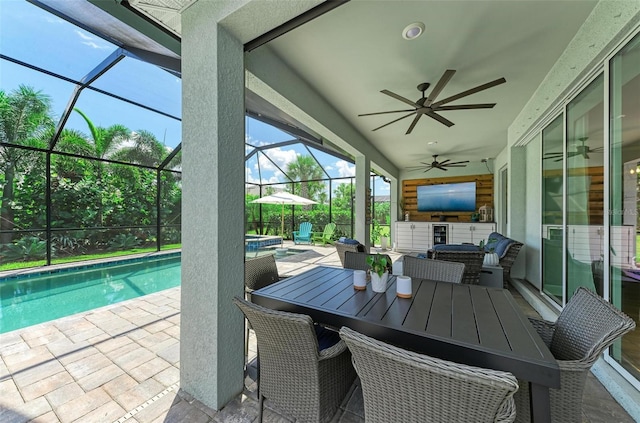 3360 Chestertown Loop, Bradenton, FL 34211 - view of patio / terrace featuring glass enclosure, outdoor dining area, ceiling fan, and a pool with connected hot tub
