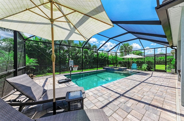 view of swimming pool with glass enclosure, an in ground hot tub, and a patio